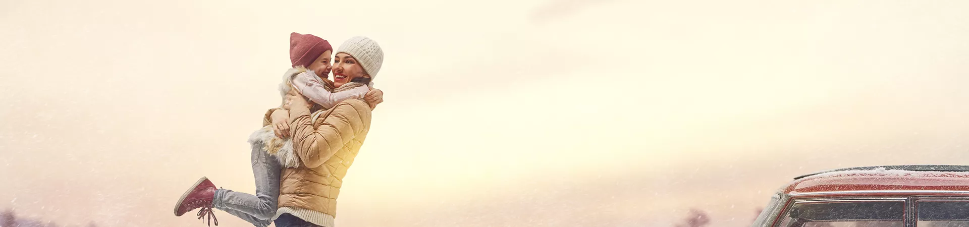 Two babies wearing colorful hats